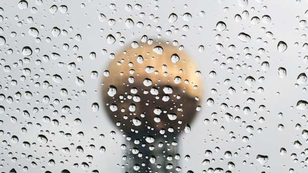 The Sunsphere is seen behind raindrops on a car window on a rainy afternoon in Knoxville, Tenn., on Thursday, Dec. 8, 2022. Kns Rain